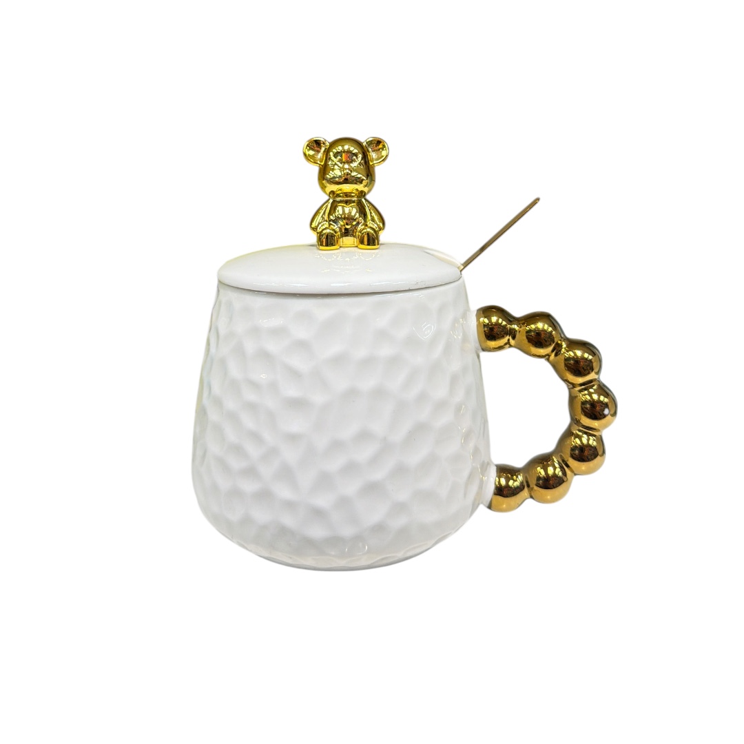 Taza surtida con figurita en tapa
